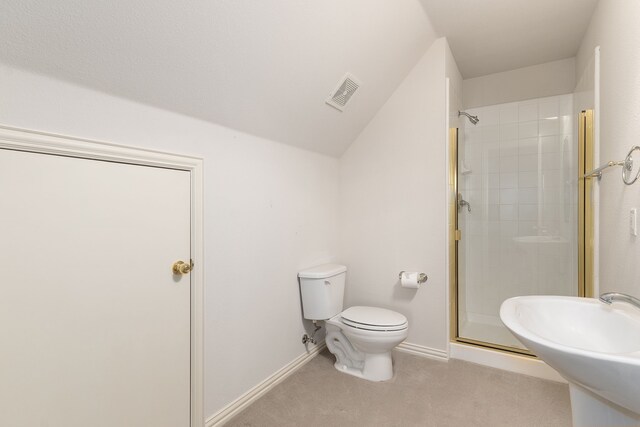 bathroom featuring toilet, an enclosed shower, and sink