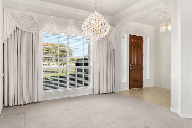 interior space with light carpet, ornamental molding, and a notable chandelier