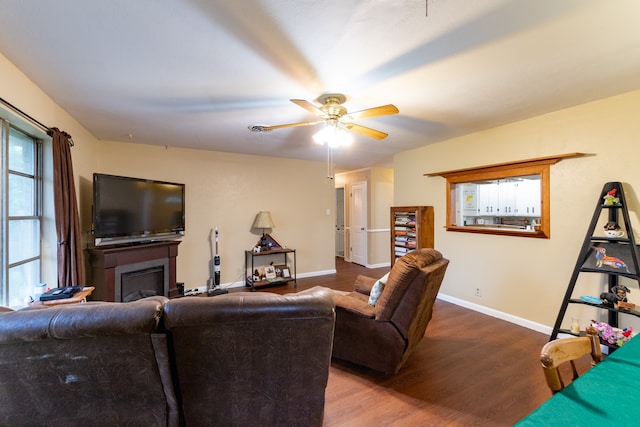 living room with ceiling fan and hardwood / wood-style floors