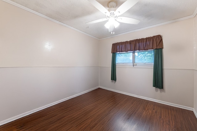 spare room with a textured ceiling, ceiling fan, ornamental molding, and dark wood-type flooring