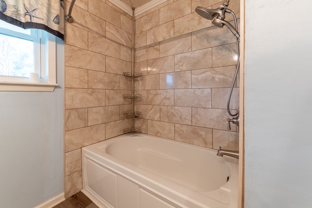 bathroom with washtub / shower combination