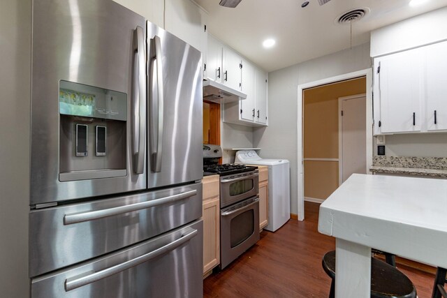 kitchen featuring washer / clothes dryer, white cabinets, dark hardwood / wood-style floors, and appliances with stainless steel finishes