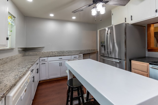 kitchen with dark wood-style floors, stainless steel refrigerator with ice dispenser, light countertops, white cabinetry, and white dishwasher