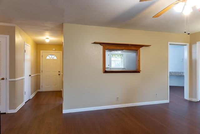 interior space featuring ceiling fan and dark hardwood / wood-style flooring