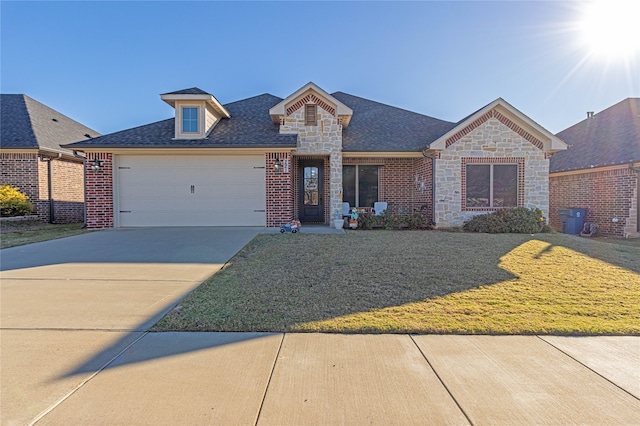 view of front of home with a garage and a front yard