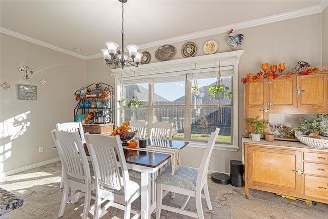 dining area featuring a chandelier and crown molding