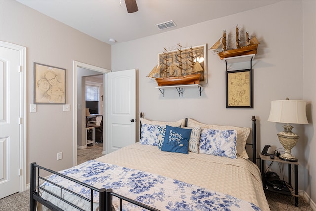 bedroom with ceiling fan and carpet floors