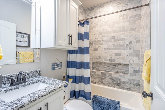 full bathroom with vanity, shower / bath combination with curtain, and toilet