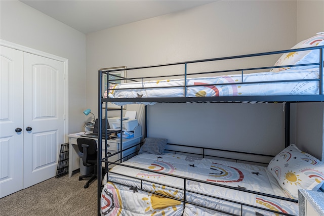 bedroom featuring light colored carpet and a closet