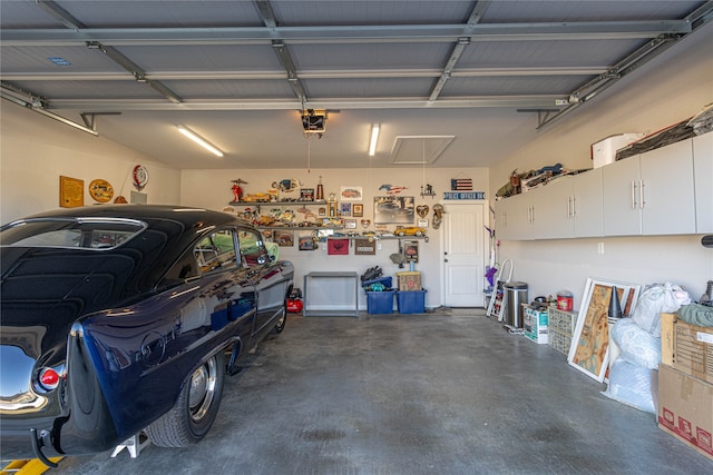 garage featuring a garage door opener