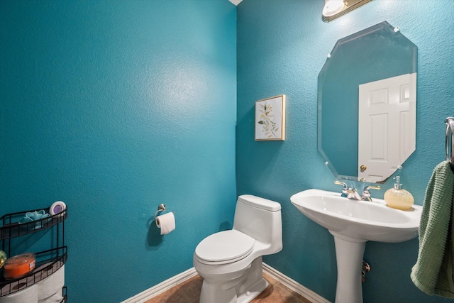 bathroom featuring toilet