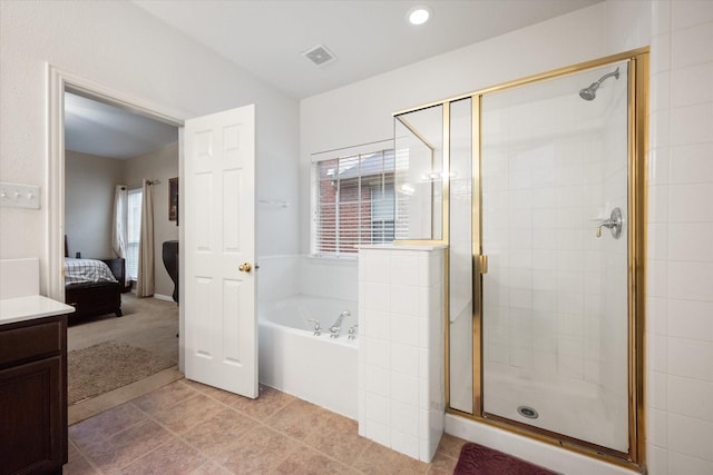 bathroom with vanity, tile patterned floors, and independent shower and bath