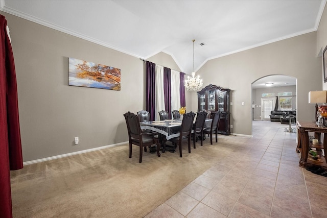 dining area with light carpet, a chandelier, crown molding, and lofted ceiling