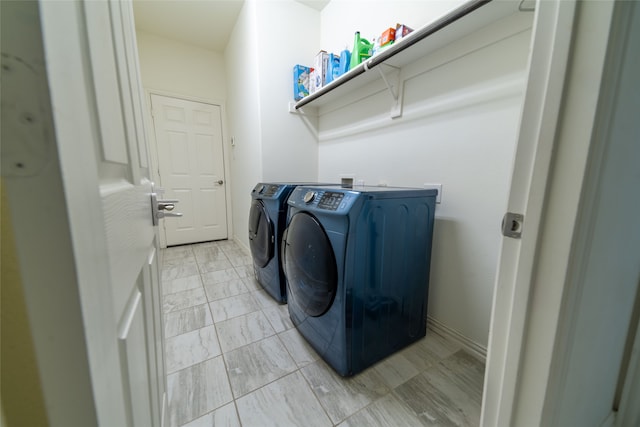 laundry room featuring washer and clothes dryer