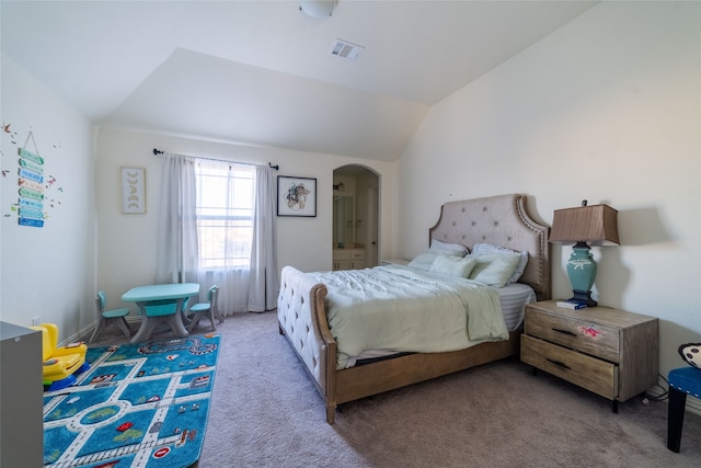 bedroom with light carpet and lofted ceiling