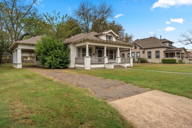 view of front of house with a porch and a front lawn