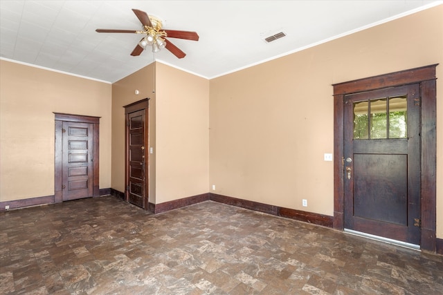 foyer with ceiling fan and crown molding