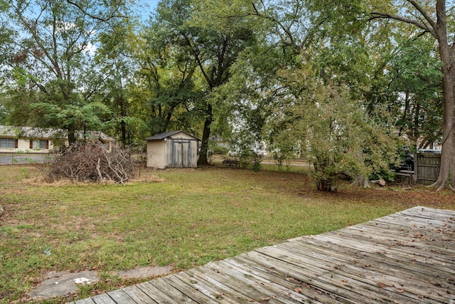 view of yard with a storage unit and a wooden deck