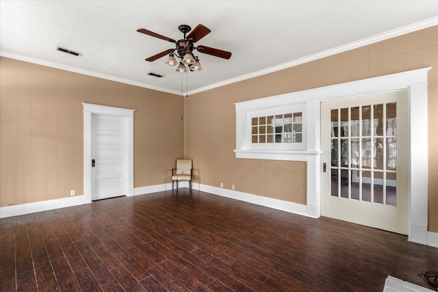 unfurnished room featuring a textured ceiling, ceiling fan, ornamental molding, and dark wood-type flooring