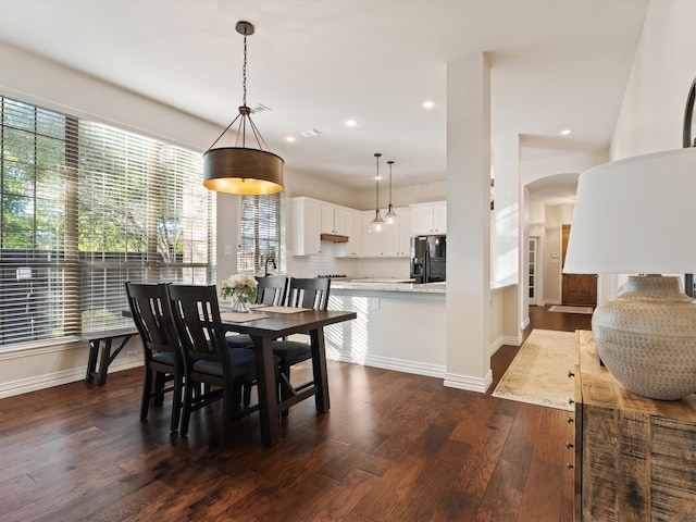 dining space with dark wood-type flooring