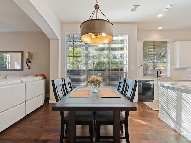 dining area featuring dark hardwood / wood-style floors and plenty of natural light