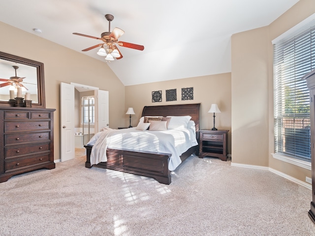 carpeted bedroom with multiple windows, lofted ceiling, and ceiling fan