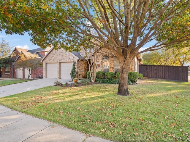 view of front facade featuring a front yard and a garage