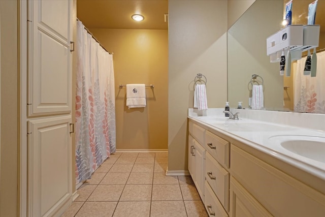 bathroom with tile patterned floors and vanity