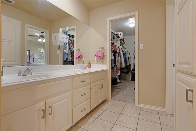 bathroom featuring tile patterned floors, vanity, and ceiling fan