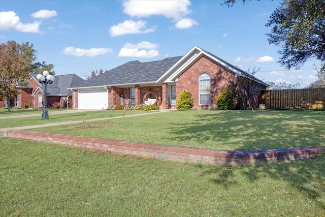 ranch-style house featuring a garage and a front lawn