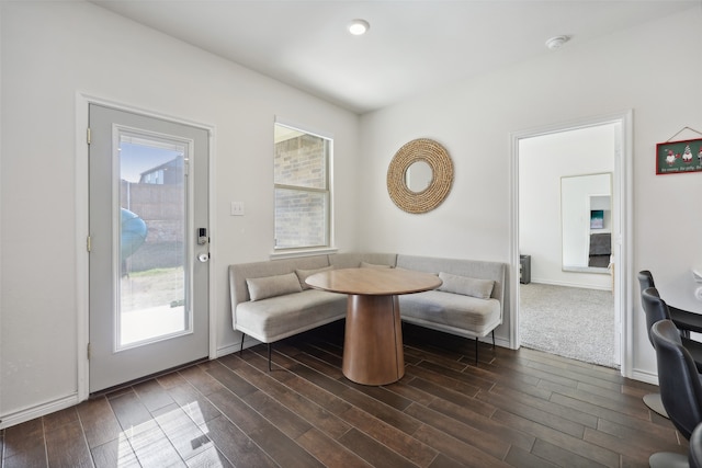 dining area featuring breakfast area and dark hardwood / wood-style floors