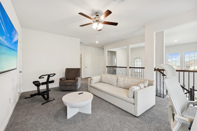 living room with carpet flooring and ceiling fan