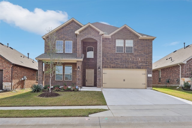 front of property with a garage and a front lawn