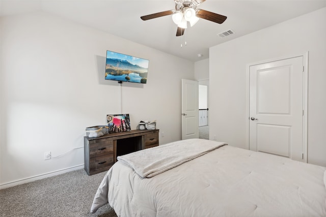 bedroom featuring carpet, vaulted ceiling, and ceiling fan