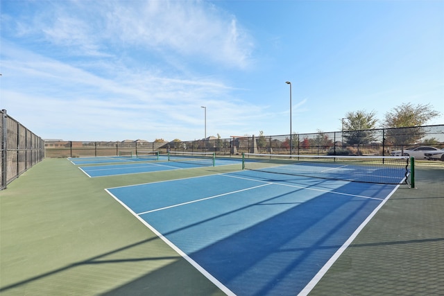 view of sport court with basketball hoop