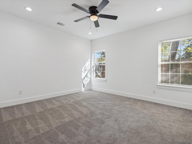 empty room featuring carpet and ceiling fan