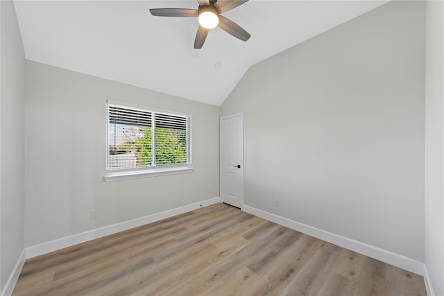 unfurnished room featuring light hardwood / wood-style floors, ceiling fan, and lofted ceiling