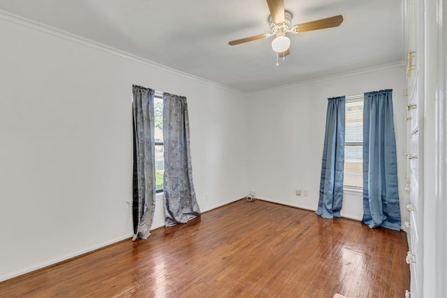 spare room featuring ornamental molding, dark hardwood / wood-style flooring, and ceiling fan