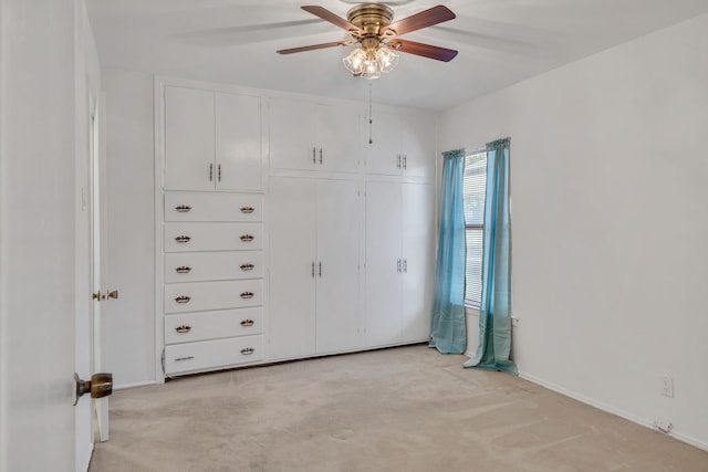 unfurnished bedroom with a closet, ceiling fan, and light colored carpet