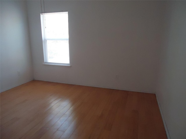 unfurnished room featuring light hardwood / wood-style floors