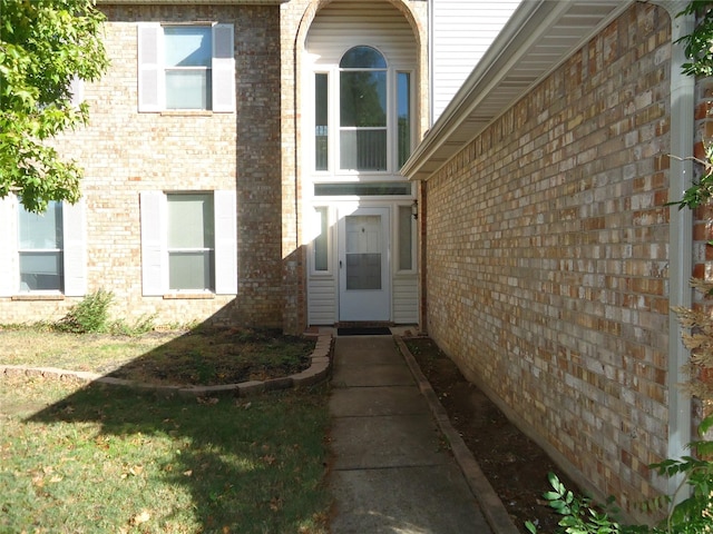 property entrance with a yard