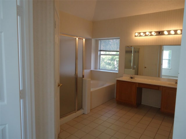 bathroom featuring tile patterned flooring, a wealth of natural light, and independent shower and bath