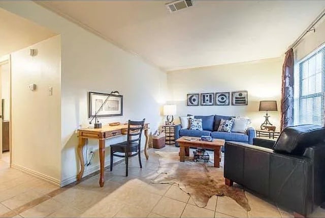 living room with light tile patterned floors