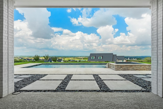 birds eye view of property with a rural view