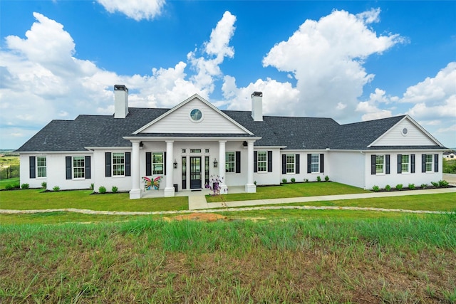 neoclassical / greek revival house with a front yard