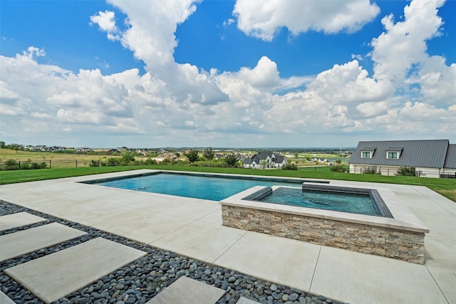 view of pool featuring an in ground hot tub, a yard, and a patio