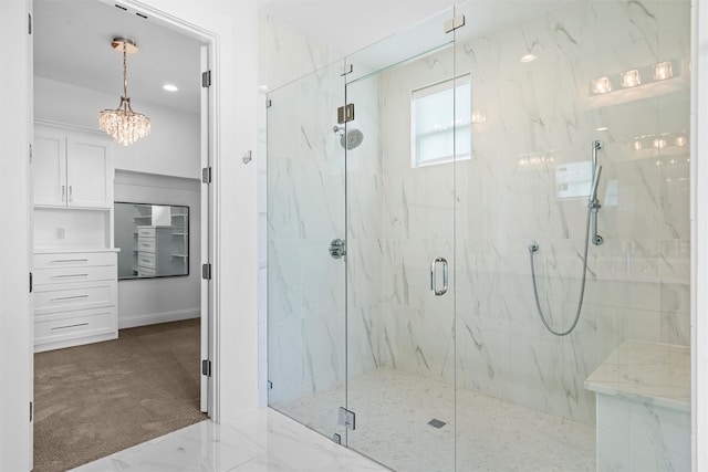 bathroom with a shower with door