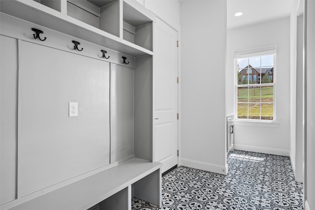 mudroom with light tile patterned floors