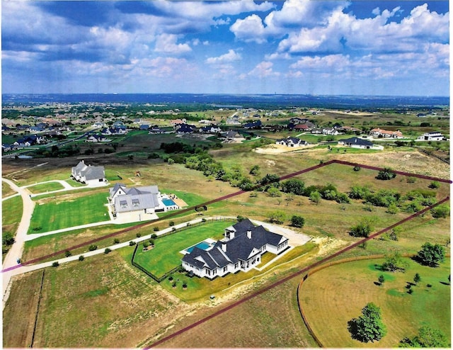 birds eye view of property featuring a rural view