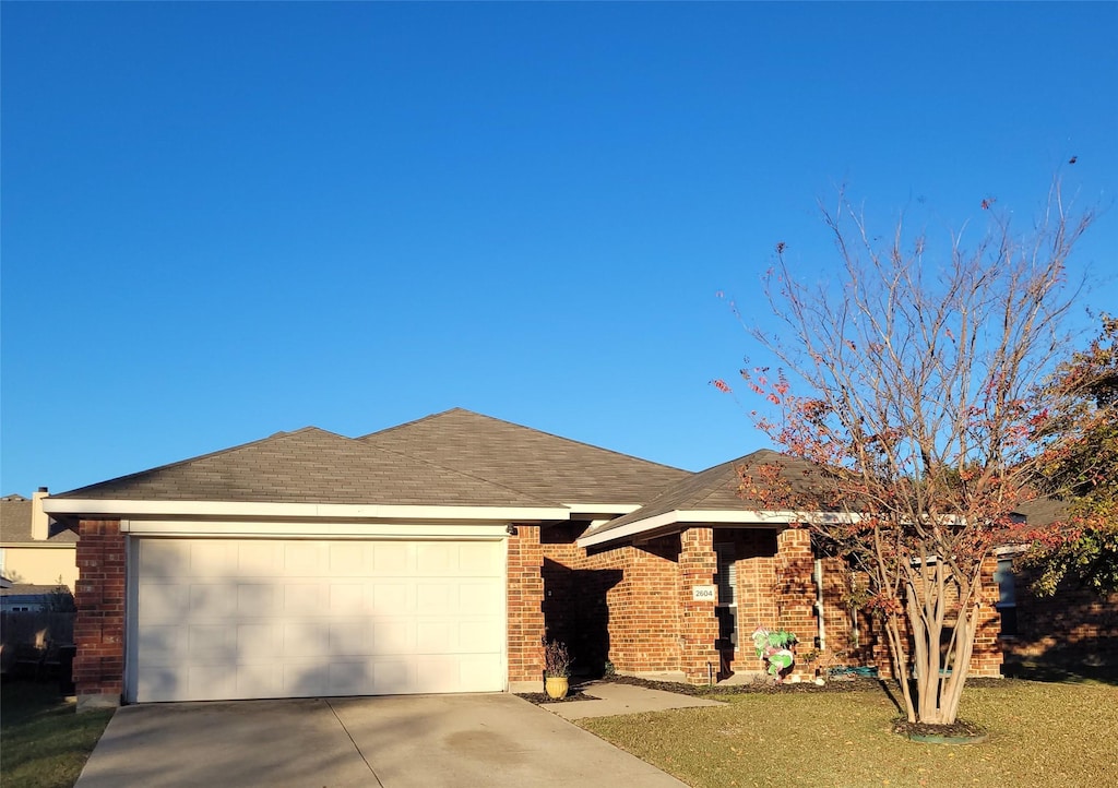 ranch-style home featuring a garage